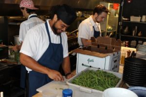 Man slicing green beans